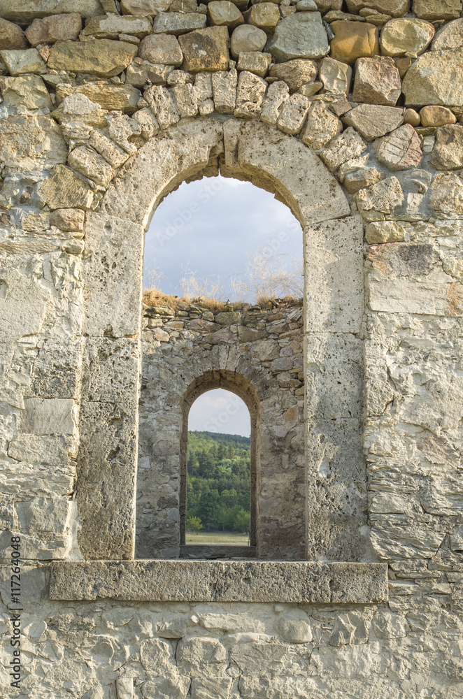 Old stone arc window in the window, , ruin of church, Bulgaria