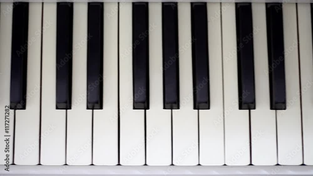 Piano keyboard background with selective focus in motion. Piano keyboard background with selective focus in motion.