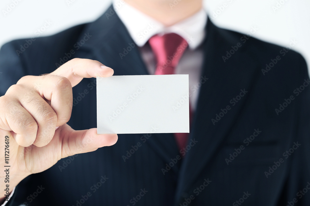Businessman holding blank card in his hand Businessman holding blank card in his hand