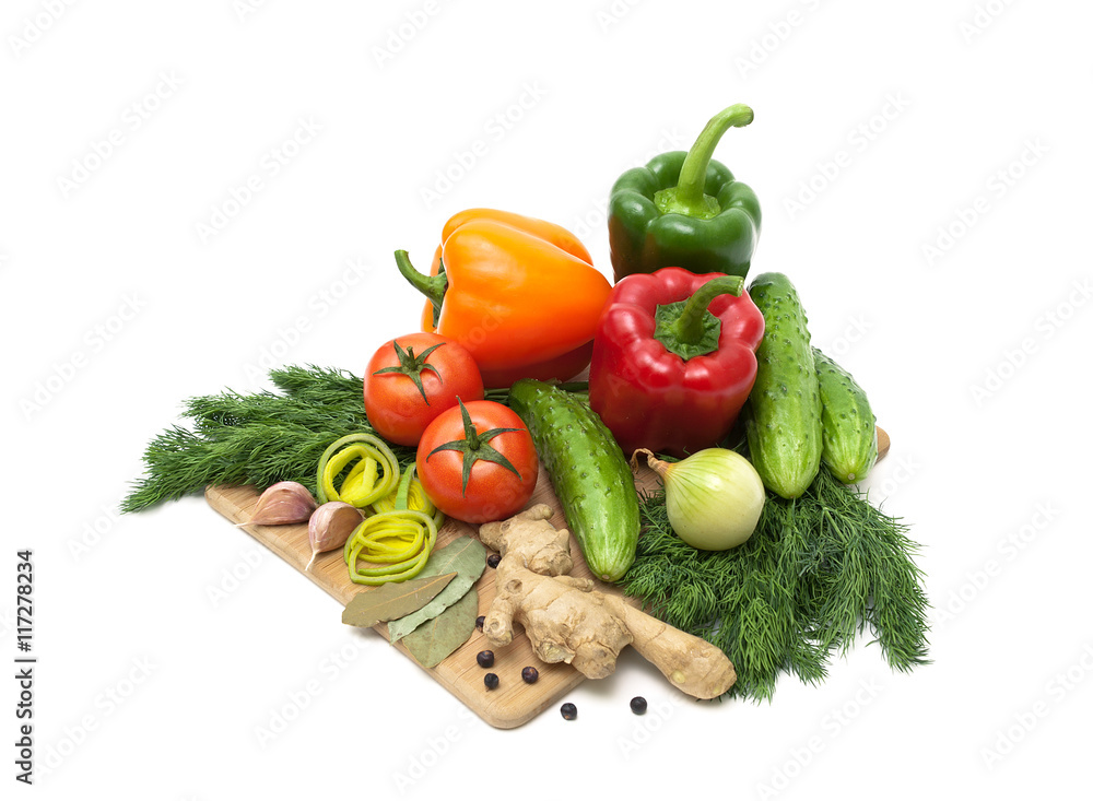 Fresh vegetables and herbs on a cutting board. Fresh vegetables and herbs on a cutting board.