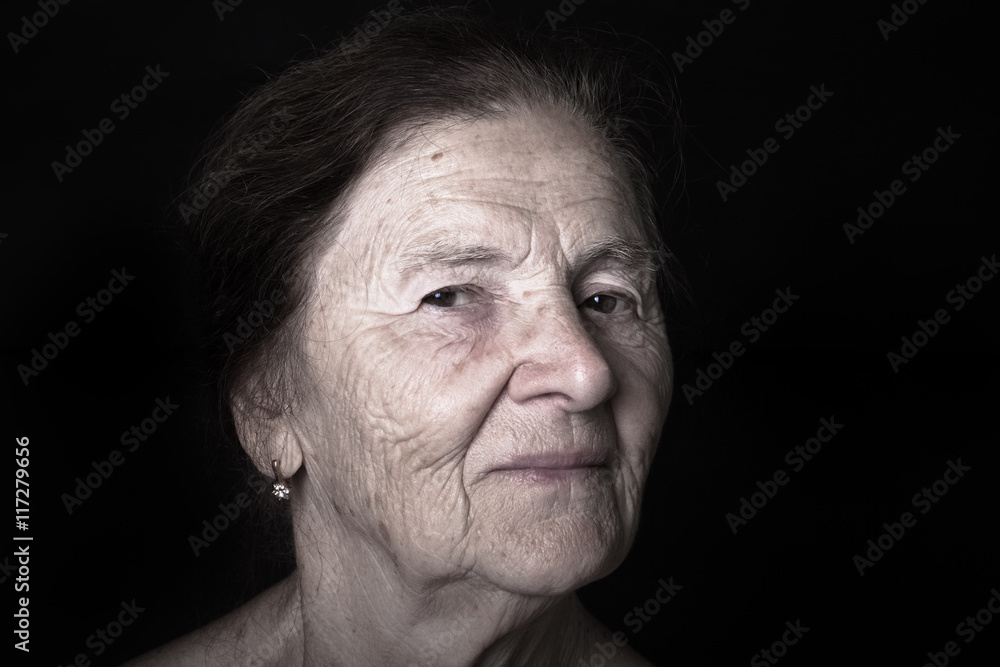 Obraz premium Portrait of elderly woman. Dreaminess. Toned