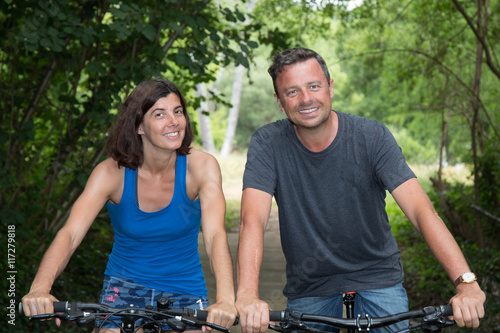 Lovers, Couple with bike in park have fun together outside
