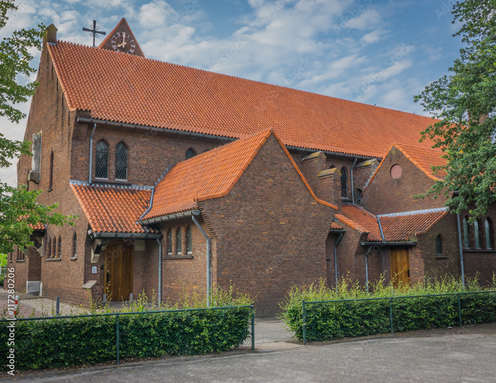 church from the side with hedge and fence church from the side with hedge and fence
