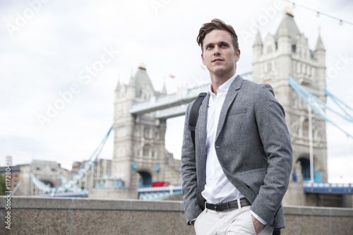 Businessman Walking To Work With Tower Bridge In Background