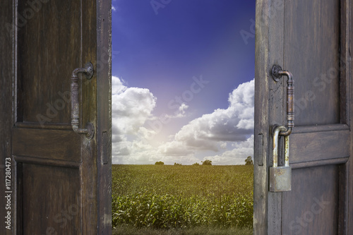 old wood window open to corn farm and blue sky cloudy - can use to display or montage on product photo