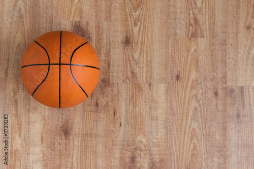 close up of basketball ball on wooden floor