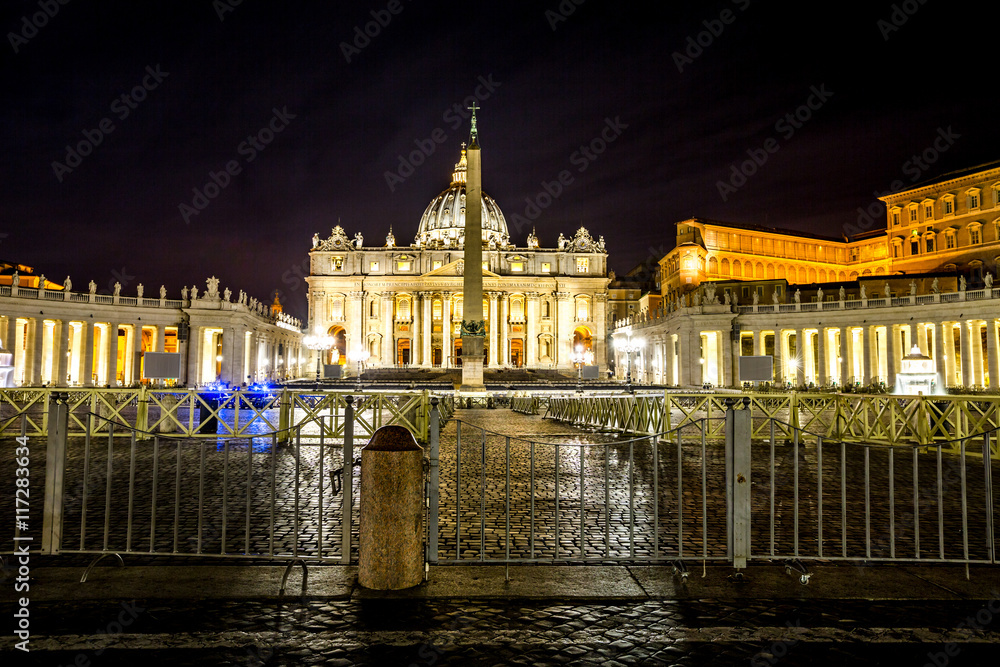Skyline of the Basilica di San Pietro by night, Vatican City in Rome, Italy.