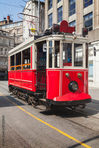 Old red tram goes on Istiklal street