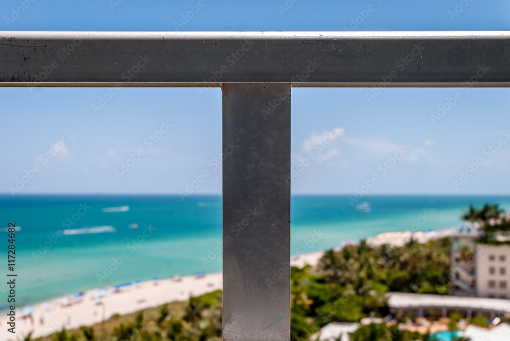 Image from balcony with tropical beach background. Abstract image of beach and sand from condo terrace view. Ocean and beach view from high-rise building. Image from balcony with tropical beach background. Abstract image of beach and sand from condo terrace view. Ocean and beach view from high-rise building.
