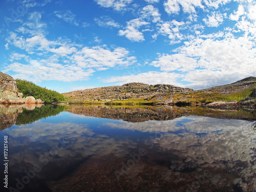 reflection in the lake. The coast of the Barents Sea © enskanto