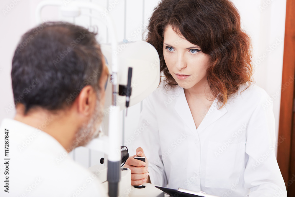 Optometrist performing visual field test Optometrist performing visual field test