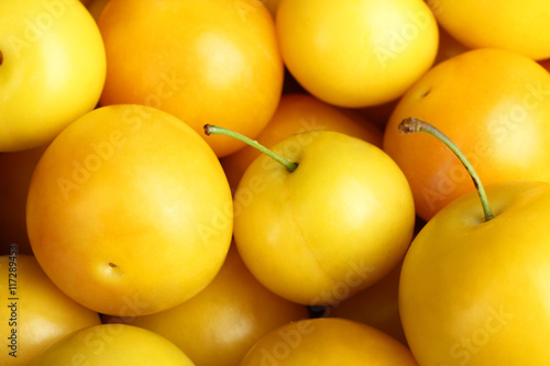 Ripe yellow plums closeup. Background.