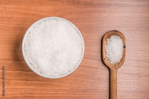 Coarse salt into a bowl and spoon