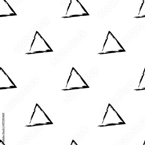 Hand Drawn vector seamless pattern made with ink. Triangles shapes isolated. Fabric design