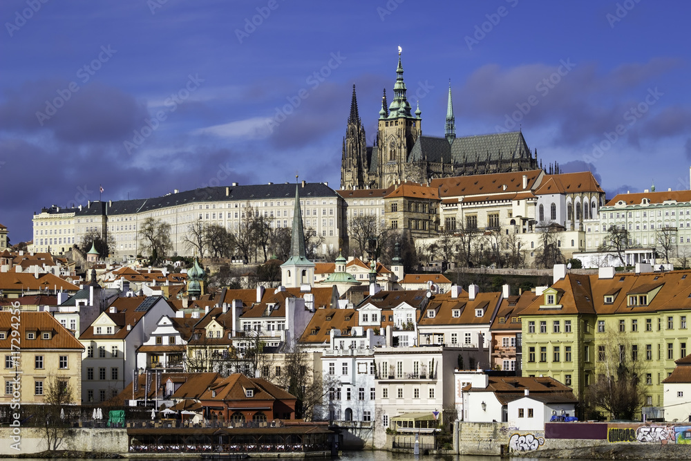 Skyline of Prague Castle and medieval houses (Hradcany) with typical orange roof tiles