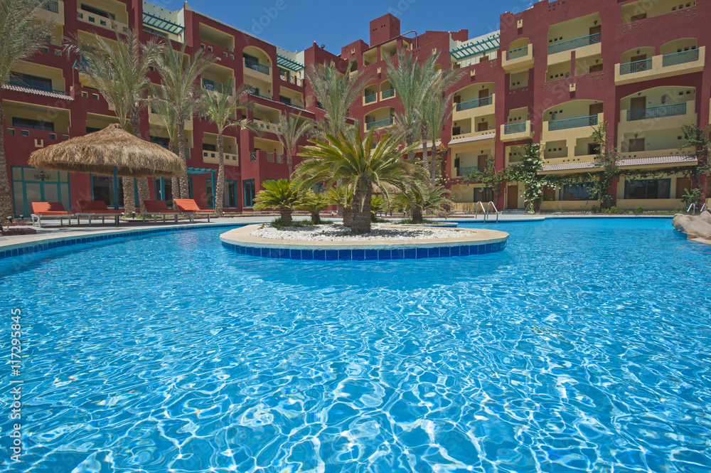 Swimming pool in luxury tropical hotel resort