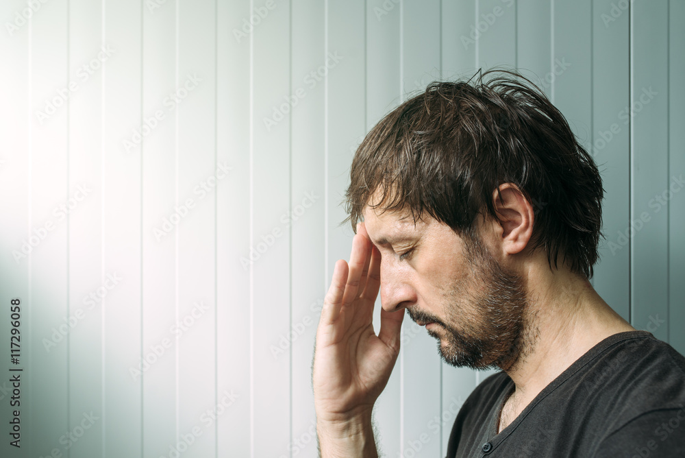 Profile portrait od miserable troubled man Profile portrait od miserable troubled man