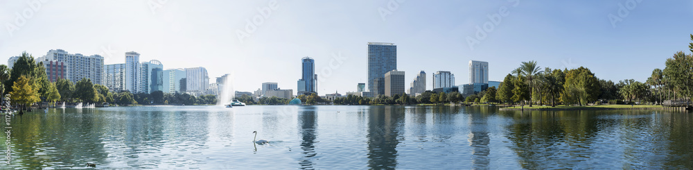 Orlando downtown Lake Eola panorama with urban buildings and reflection