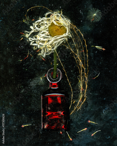 Ornate glass bottle vase with gnarled flower