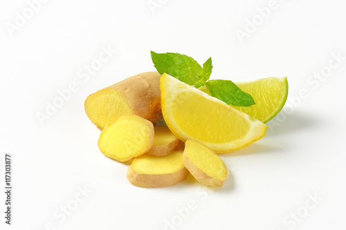sliced ginger with lemon and lime