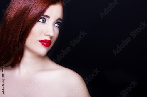 Gorgeous young woman with long eyelashes and red lips. Perfect makeup.