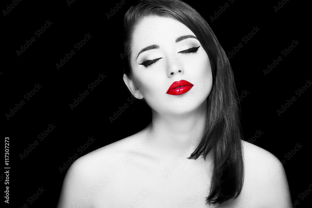 Fototapeta premium Gorgeous young woman with long eyelashes and red lips. Perfect makeup.