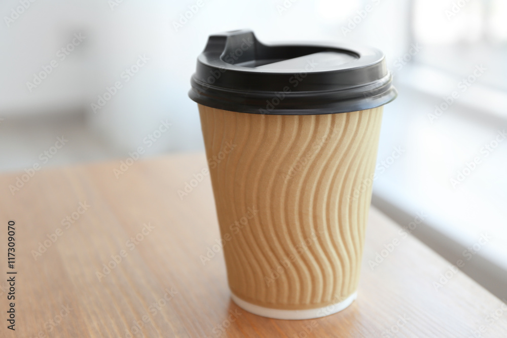 Paper cup of coffee on light background Paper cup of coffee on light background
