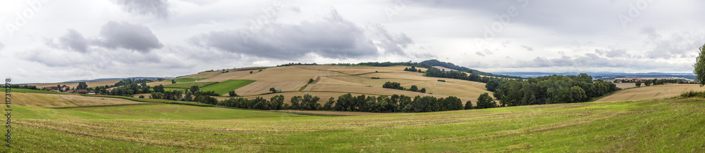 Rural landscape with fields and clouds near Felsberg Rural landscape with fields and clouds near Felsberg