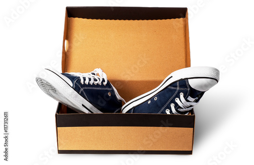 Dark blue sports shoes in cardboard box