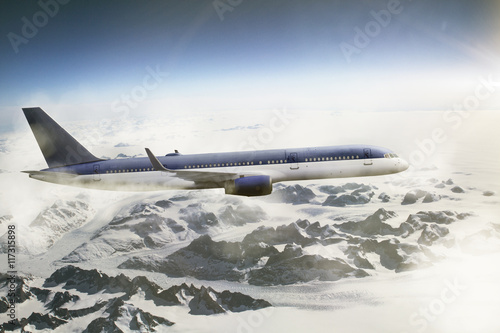 Plane flying over snow area