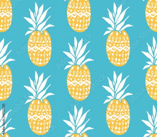 Pineapple texture with hand drawn yellow fruits at blue background. Seamless vector pattern.