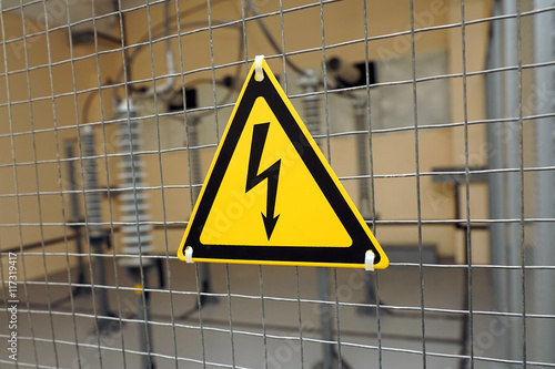 Yellow triangular sign of electrical hazards.