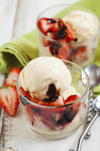 Vanilla ice cream with strawberries and balsamic sauce photo