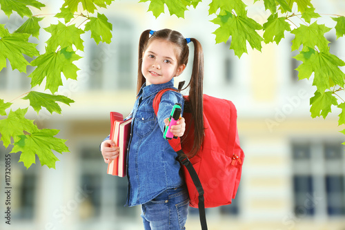 Little girl with red back p...