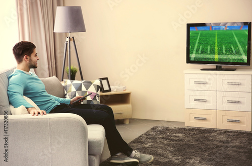 Man watching football game ...