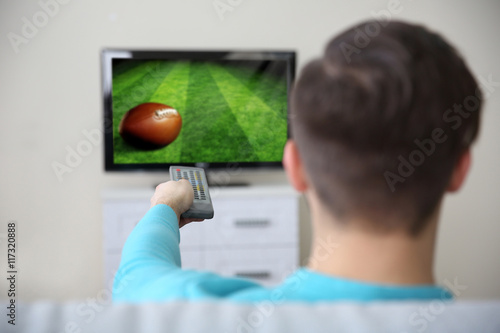 Man watching football game ...