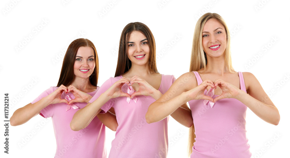 Beautiful young women in pink shirts on white background. Breast cancer concept Beautiful young women in pink shirts on white background. Breast cancer concept