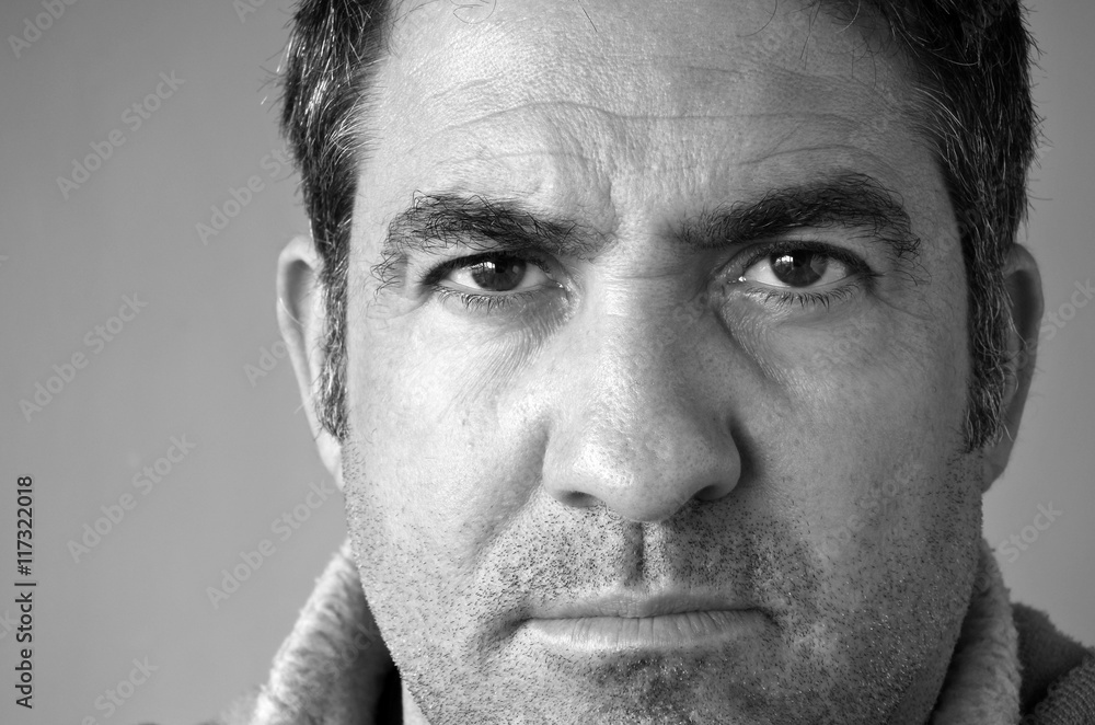 Confident middle aged man looks at the camera Confident middle aged man looks at the camera