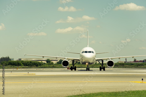 Airplane ready to take off from runway