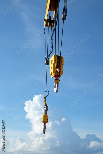 Crane hooks on work site, Crane on Oil and gas platform for transfer cargo and Controlled by Crane operator. Crane background and empty area for text.