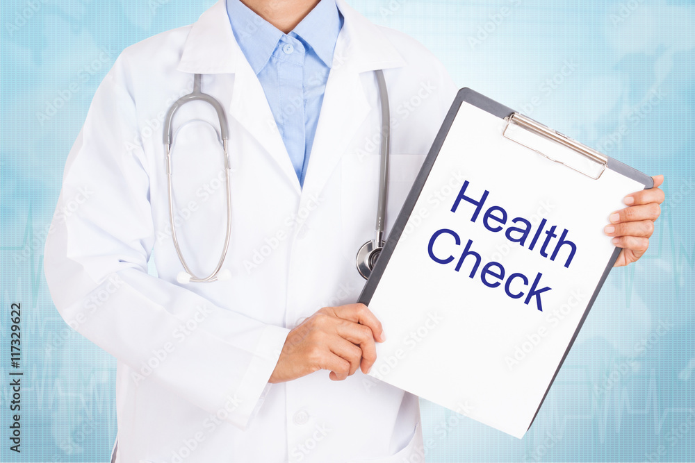 Doctor holding clipboard with health check text on a sheet of paper on white background Doctor holding clipboard with health check text on a sheet of paper on white background