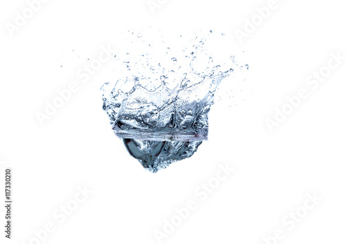 Ice Cube Dropping in Healthy Water. Splashes