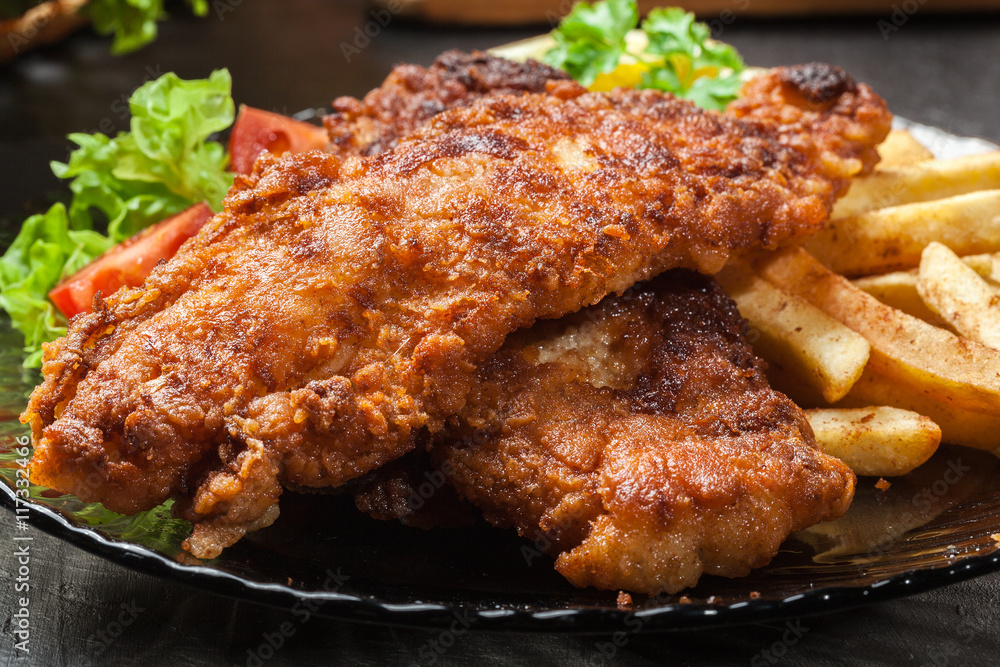 Fried fish in crispy batter with chips Fried fish in crispy batter with chips