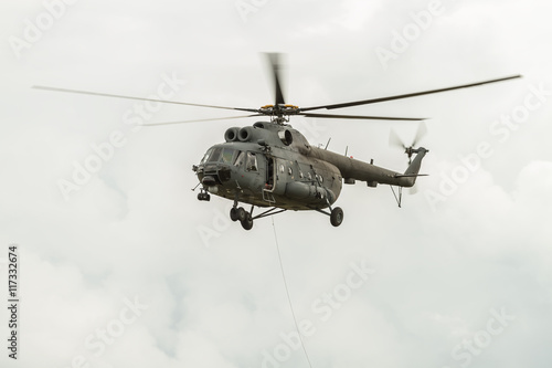 Fototapeta Naklejka Na Ścianę i Meble -  Helicopter in cloud sky