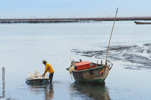 The fishermen returned to shore from fishing in the morning.