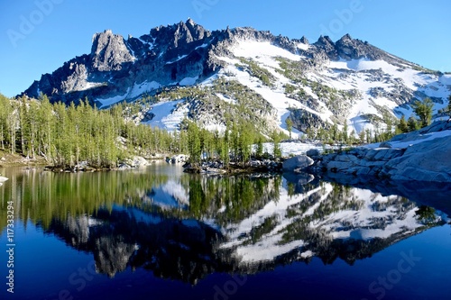 Reflection of mountain in alpine lake. Enchantment lakes basin near Leavenworth and Seattle, WA.  © aquamarine4