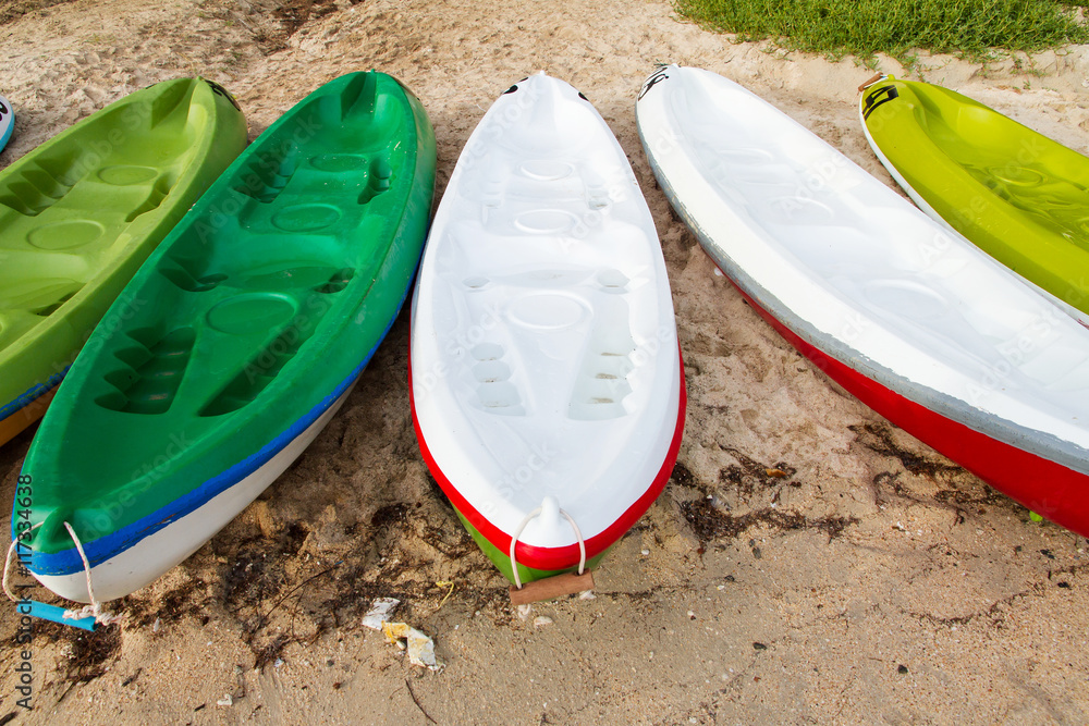 Colourful sea kayaks on the beach.Thailand Colourful sea kayaks on the beach.Thailand