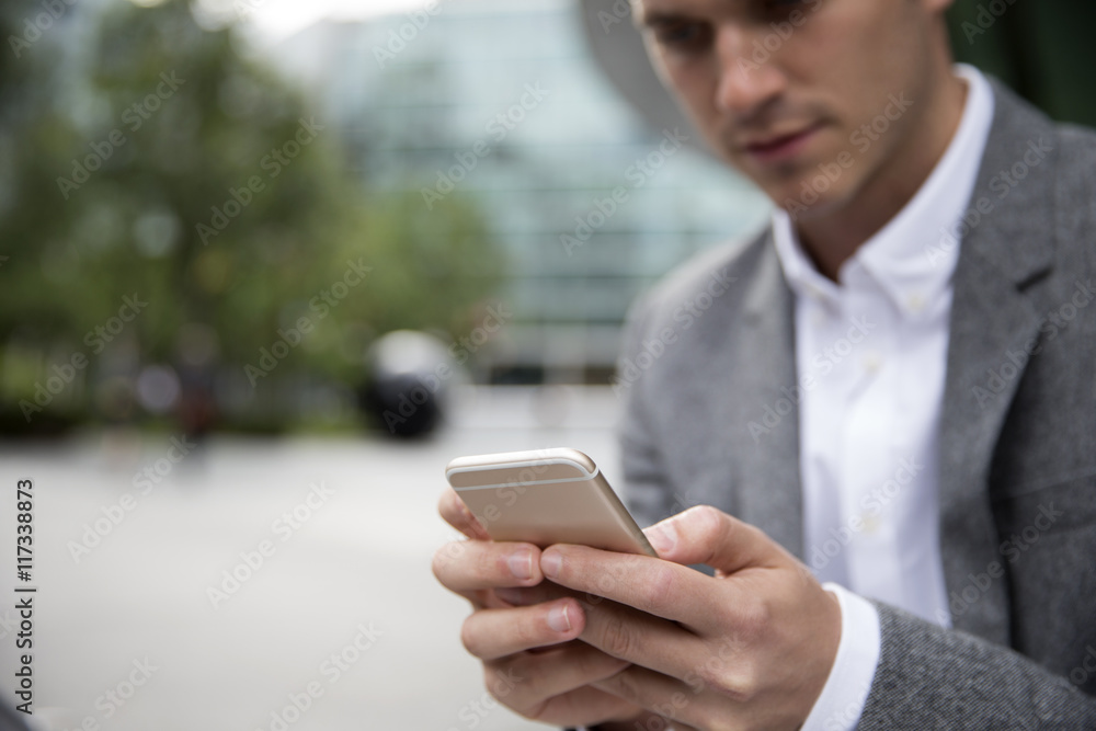 Businessman Checking Mobile Phone Messages Outside Office Businessman Checking Mobile Phone Messages Outside Office