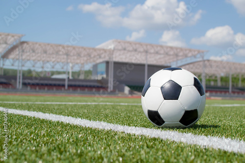 soccer ball on the green field © StockBox