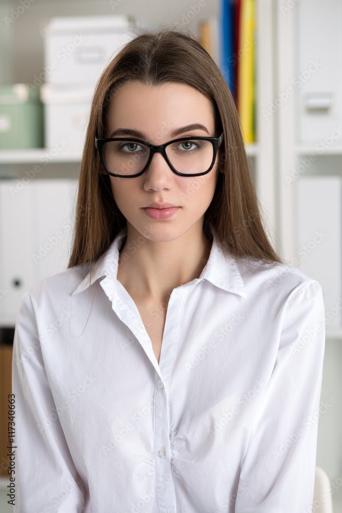 Portrait of young female student wearing big black glasses Portrait of young female student wearing big black glasses